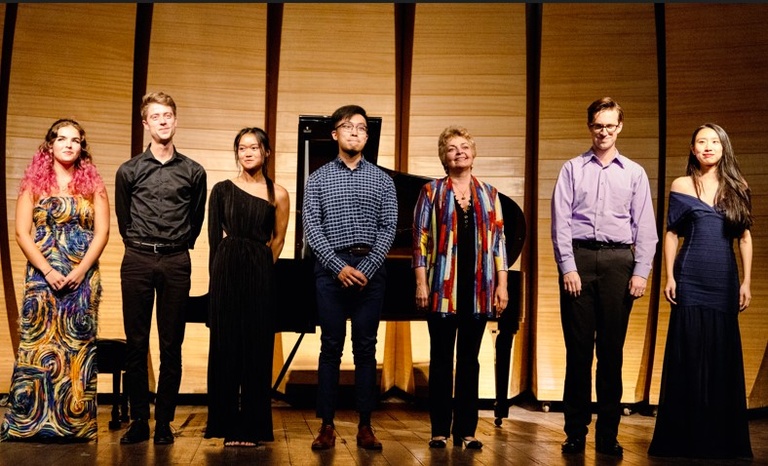 Katya Moeller, Craig Jordan, Ana Yam, Peter Bowen Liu, Dr. Ksenia Nosikova, Neil Krzeski, and Canlin Qiu stand for ovation after UI Recital During the Making Connections Piano Festival in Brazil