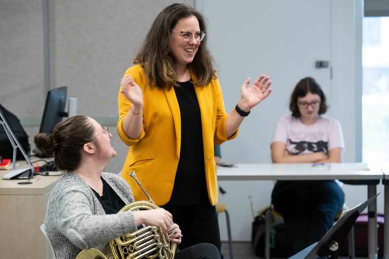 Dr. Katy Ambrose teaching students in Horn class