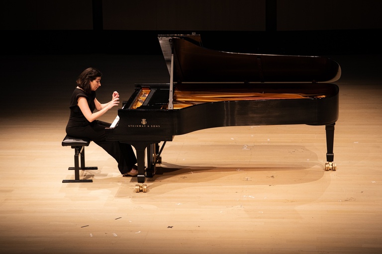 pianist performing in black dress