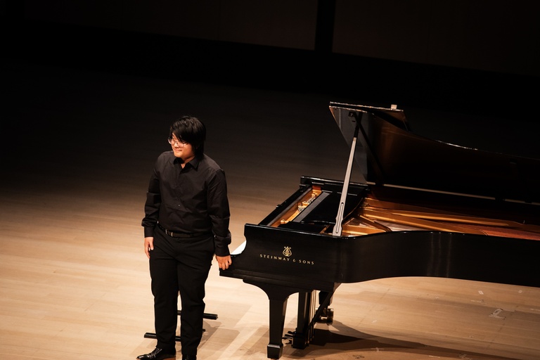 pianist taking a bow after performance