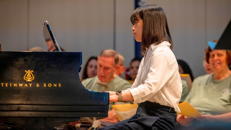 piano player performing with a choir