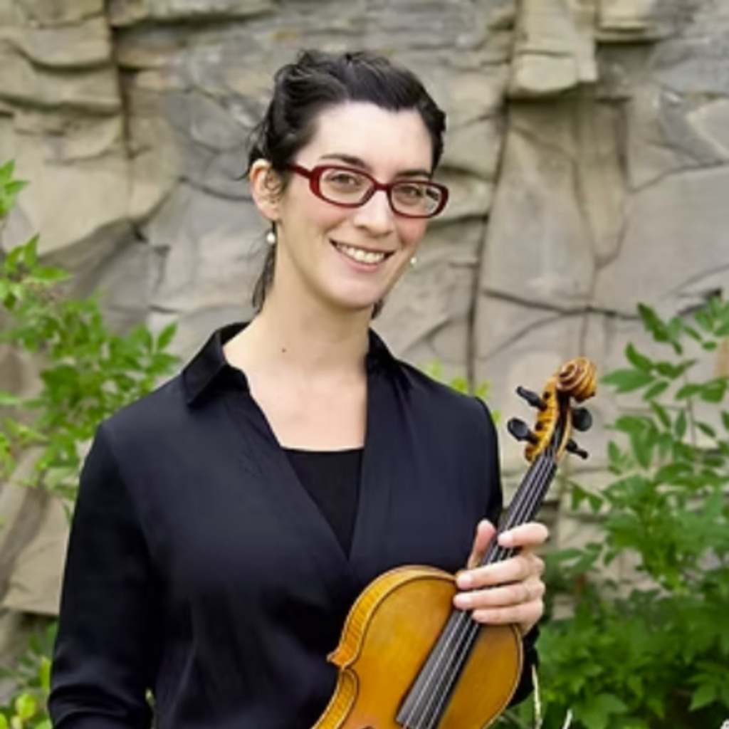 Megan Karls holding her violin