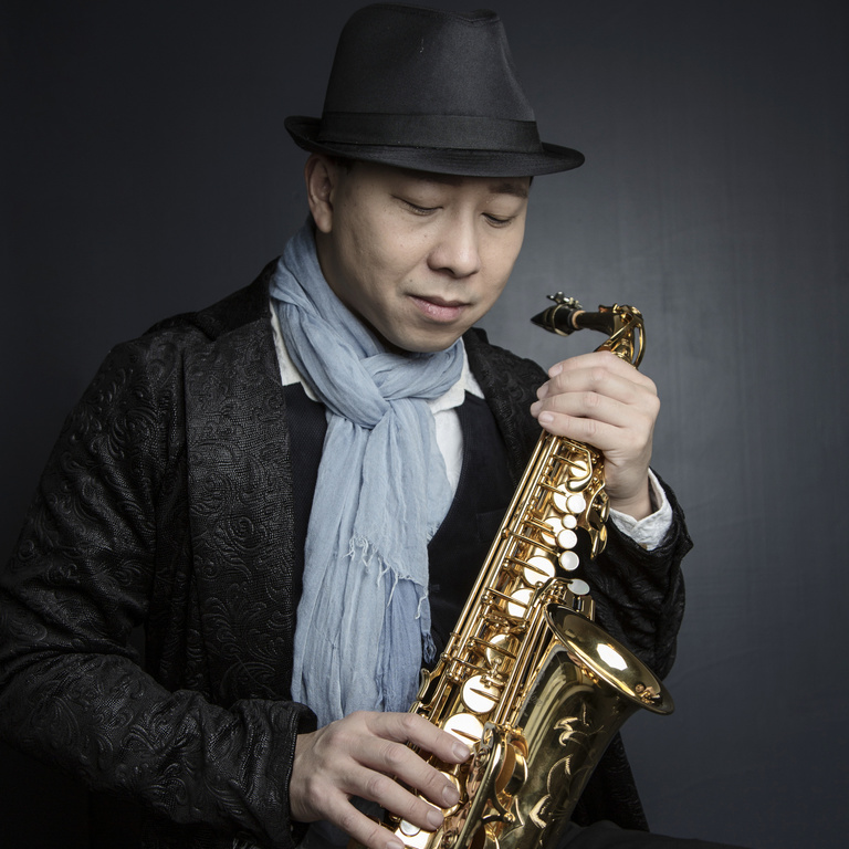 A portrait of saxophonist Kenneth Tse