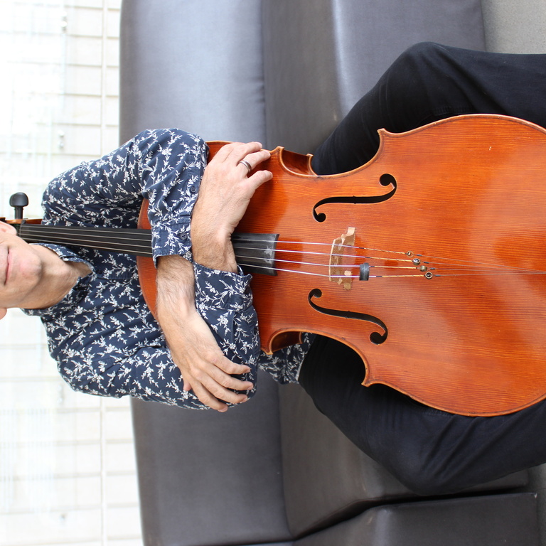 anthony arnone holding his cello