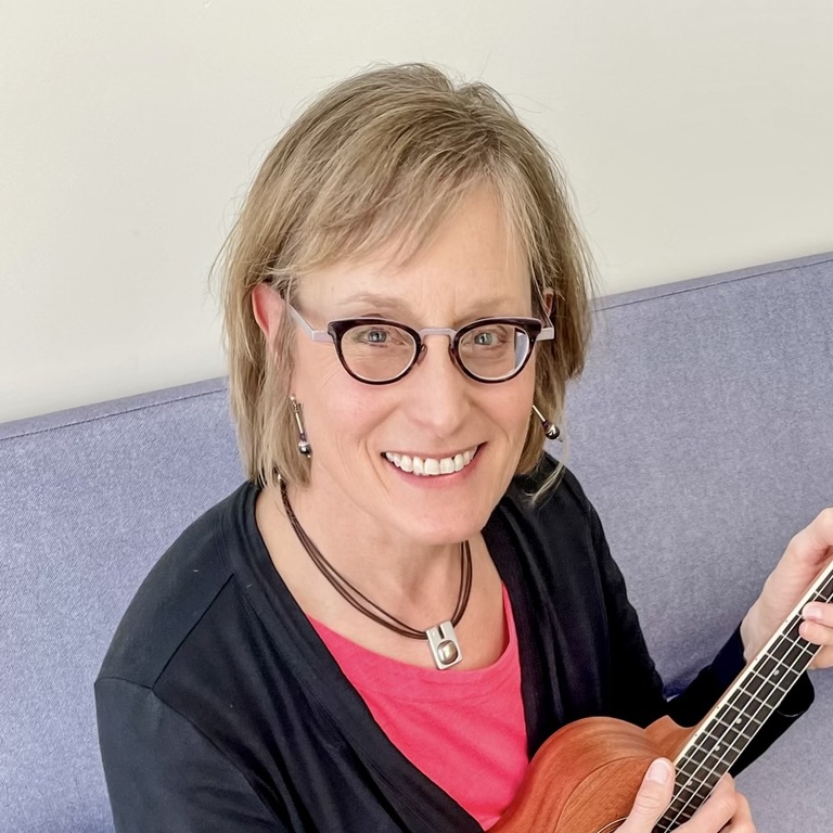 Professor Kirsten Nelson holding a Ukelele