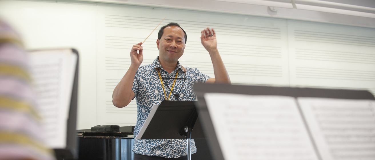 Faculty teaching a music class