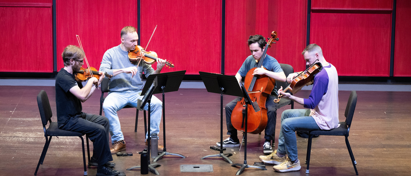 JACK Quartet playing in Voxman's Recital Hall as part of a collaboration between Hancher Auditorium and the School of Music, part of the String Quartet Residency Program