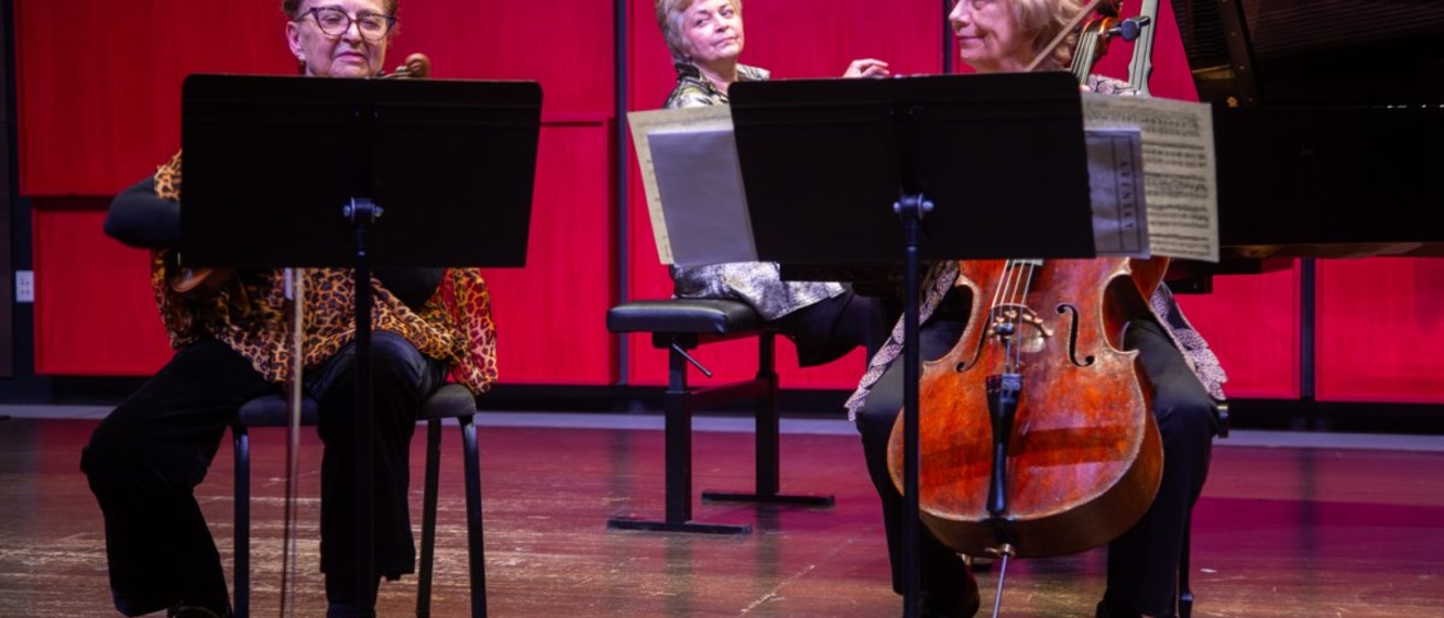 Almita Vamos plays the violin, Tanya Carey plays the cello, and Ksenia Nosikova plays the piano during the Guest Chamber Recital at Voxman Music Building on Sunday, Nov. 9, 2025.