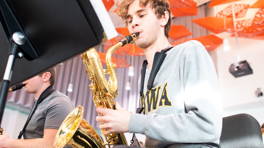 student musician playing the saxophone in a Jazz class in Voxman Music Building