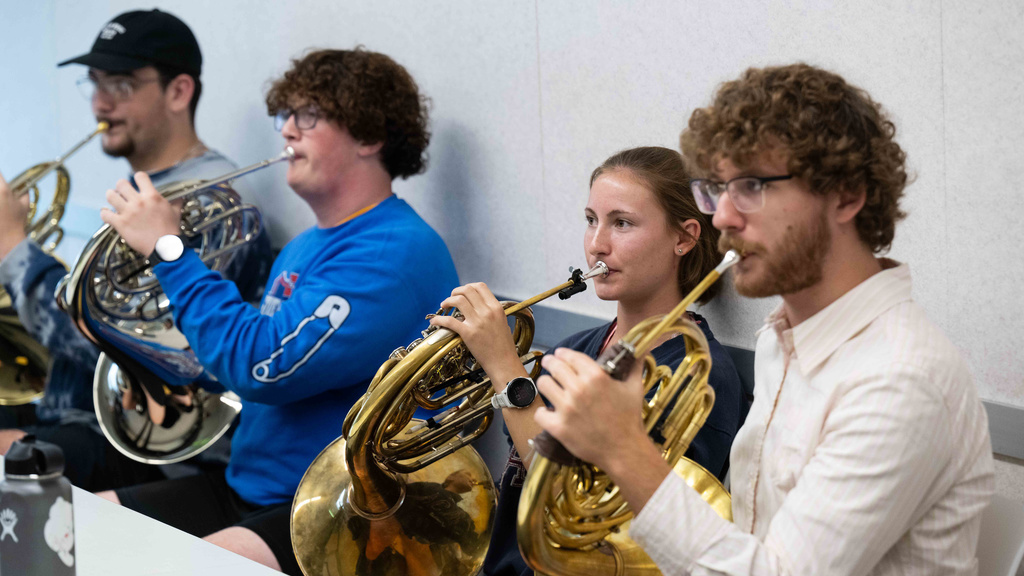 young student musicians in a horn class in Voxman Music Building