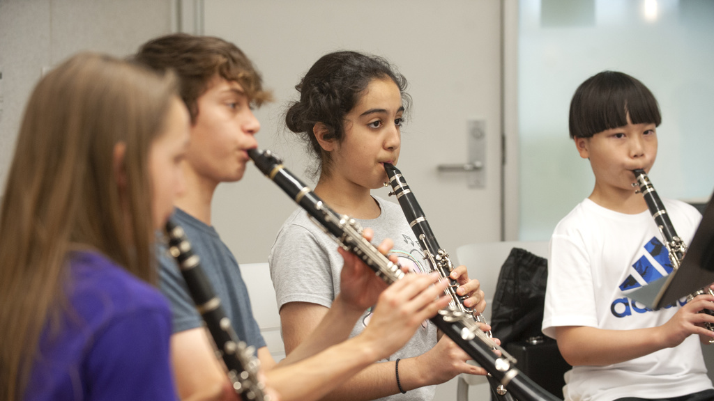 four young musicians playing clarinet in Iowa Summer Music Camps