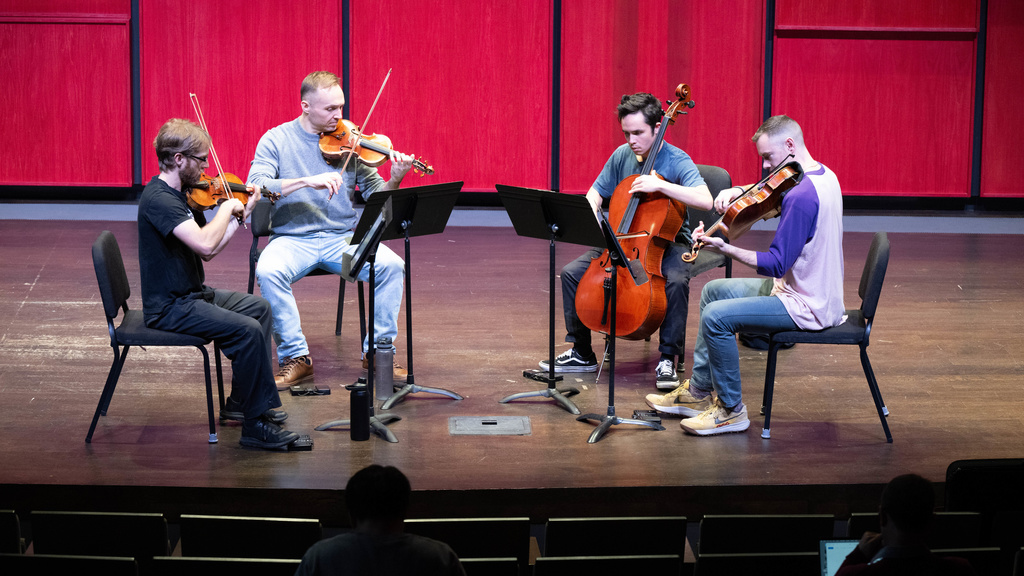JACK Quartet playing in Voxman's Recital Hall as part of a collaboration between Hancher Auditorium and the School of Music, part of the String Quartet Residency Program