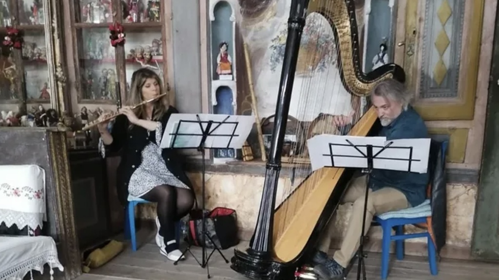 Nicole Esposito playing music with harpist Cagatay Akyol in Turkey