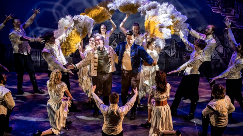 2024 Music and Theatre BA Brandon Burkhardt performing onstage during Theatre Cedar Rapids' production of "Something Rotten!" in 2024